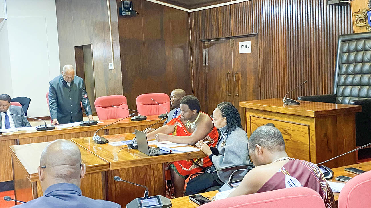 Minister for Economic Planning and Development Dr Tambo Gina reading his preamble yesterday during the ministry's annual performance report debate by the ministry's portfolio committee whose chairman is Appointed MP Prince Lindani. (Pics: Khulile Thwala)